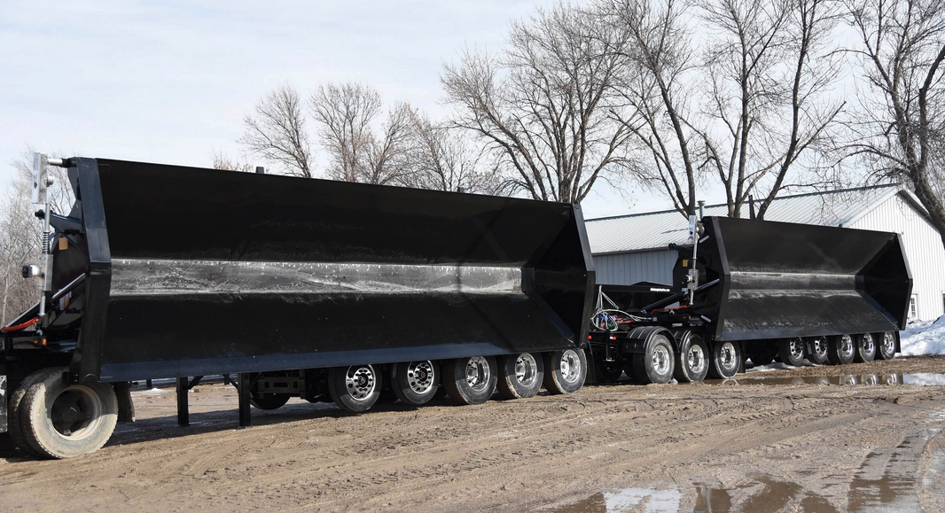 Side dump trailers in dump position